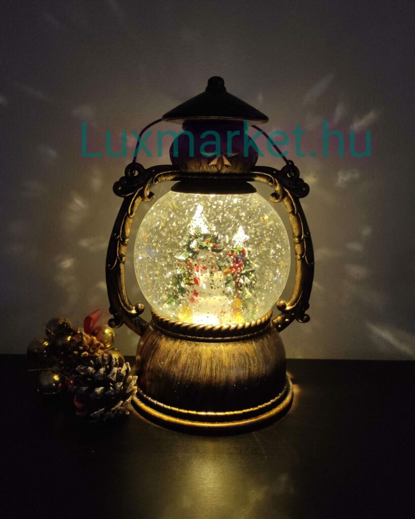 Karácsonyi LED lámpás zenél világít hóesést imitál 21 cm hóember motívummal