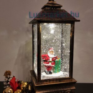 Karácsonyi LED lámpás zenél világít hóesést imitál 23 cm mikulás motívummal